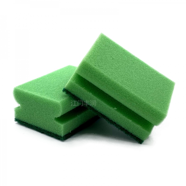 Green pitted kitchen cleaning sponge